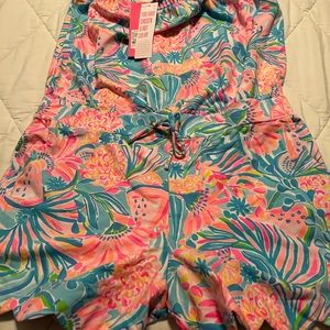 This is a beautiful romper NWT, X-Large,96% cotton and 4% spandex.